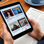 A person comfortably wearing headphones, deeply immersed in French media on a tablet or phone (showing a French film or podcast interface). French books and a notebook are present, illustrating daily language immersion and active listening in a cozy setting.